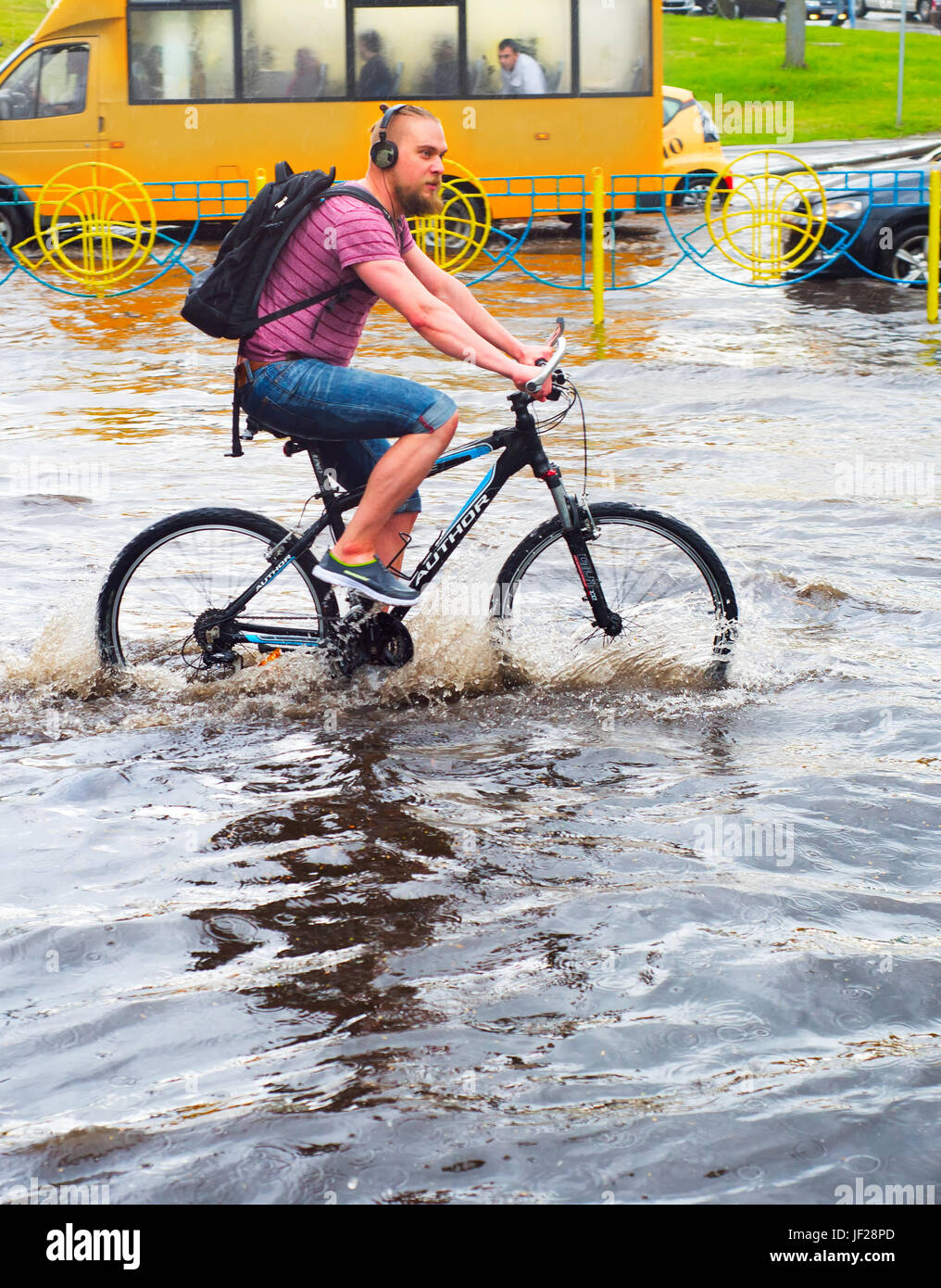 Ride bicycle in the rain Stock Photo Alamy