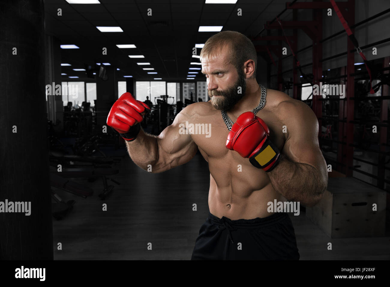 Strong muscular man boxing at the gym Stock Photo - Alamy