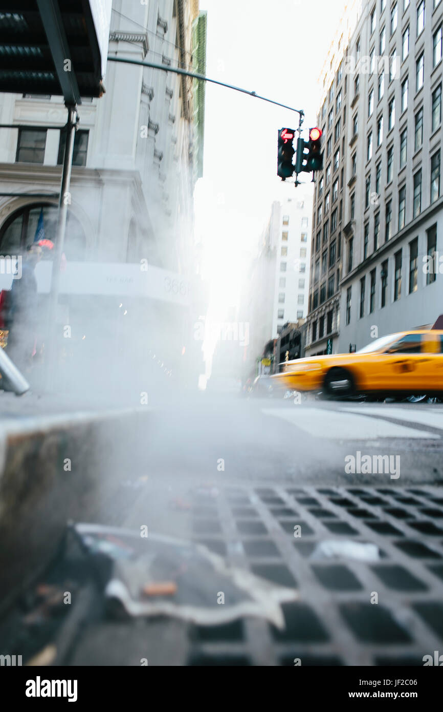 Steam coming out of drain on New York City street, USA Stock Photo Alamy