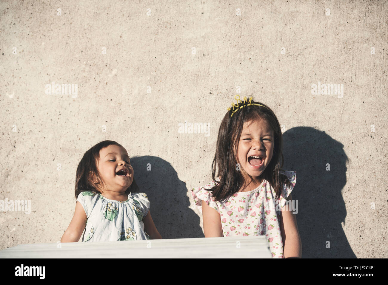 Two asian children laughing hi-res stock photography and images - Alamy
