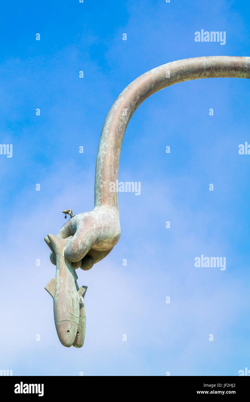 Hand with herring, detail of herring eater sculpture, part of Fairytales by the sea on boulevard of Scheveningen, The Hague, South Holland, Netherland Stock Photo