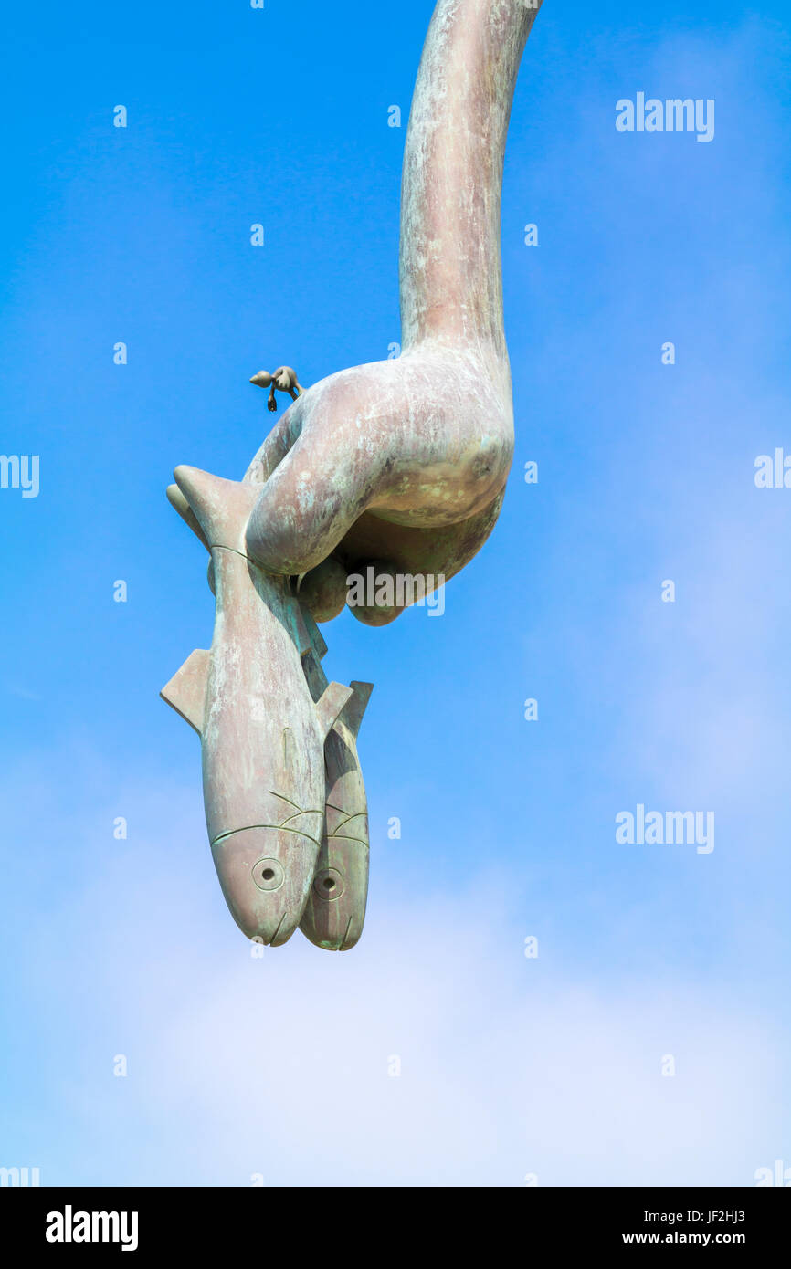 Hand with herring, detail of herring eater sculpture, part of Fairytales by the sea on boulevard of Scheveningen, The Hague, South Holland, Netherland Stock Photo