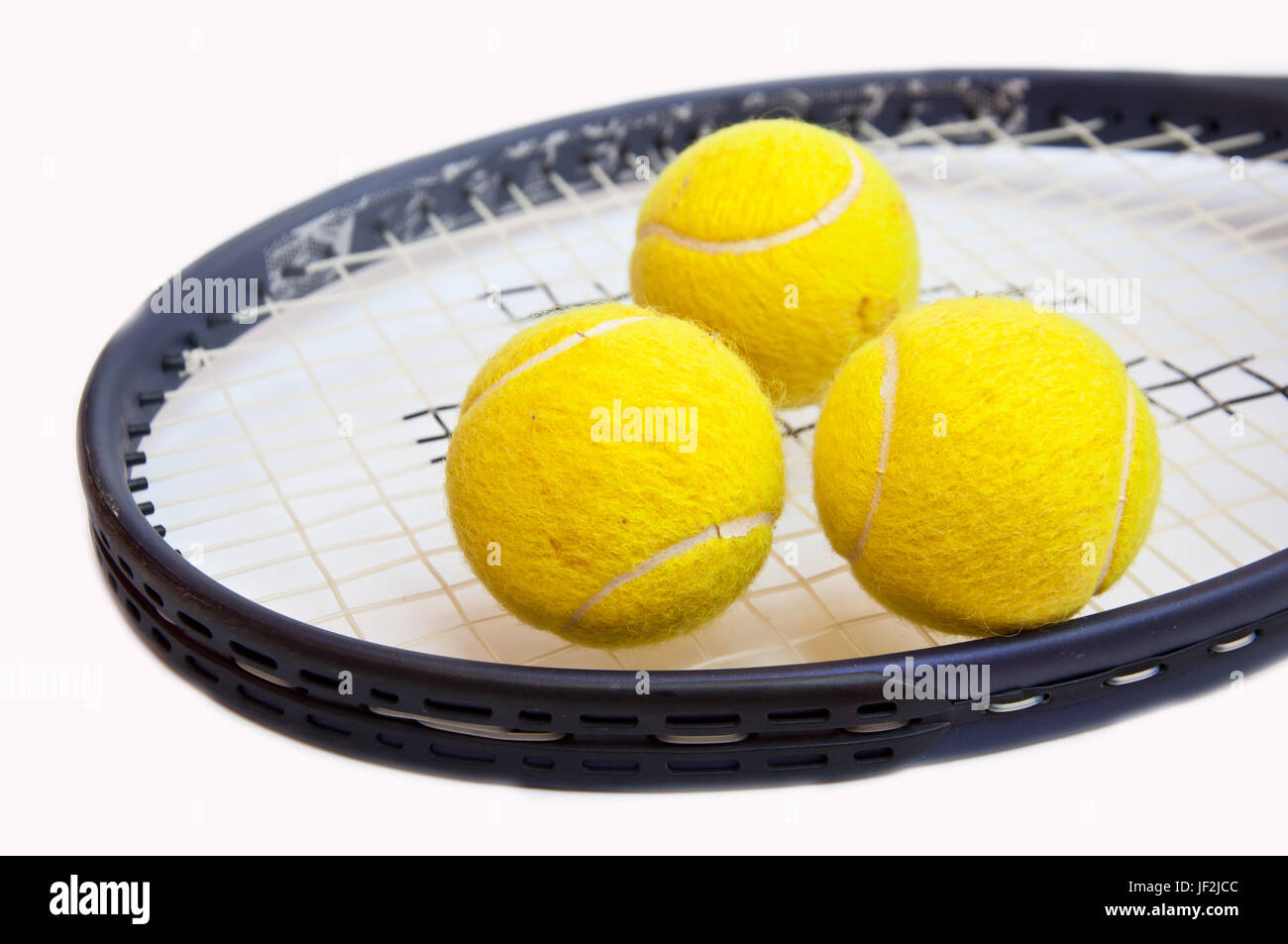 tennis ball on racket on white background Stock Photo - Alamy