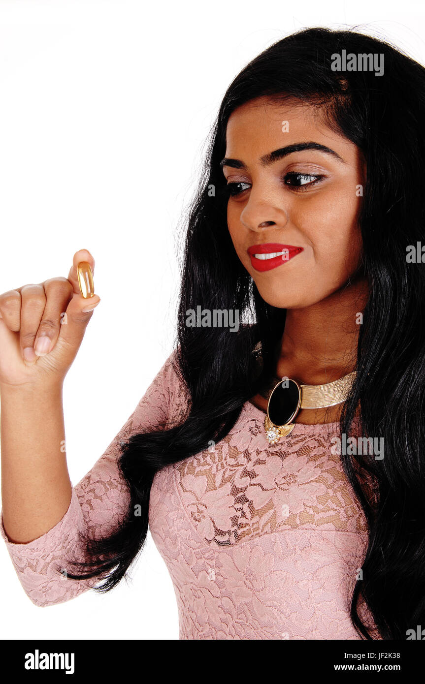 Woman holding vitamin pill. Stock Photo