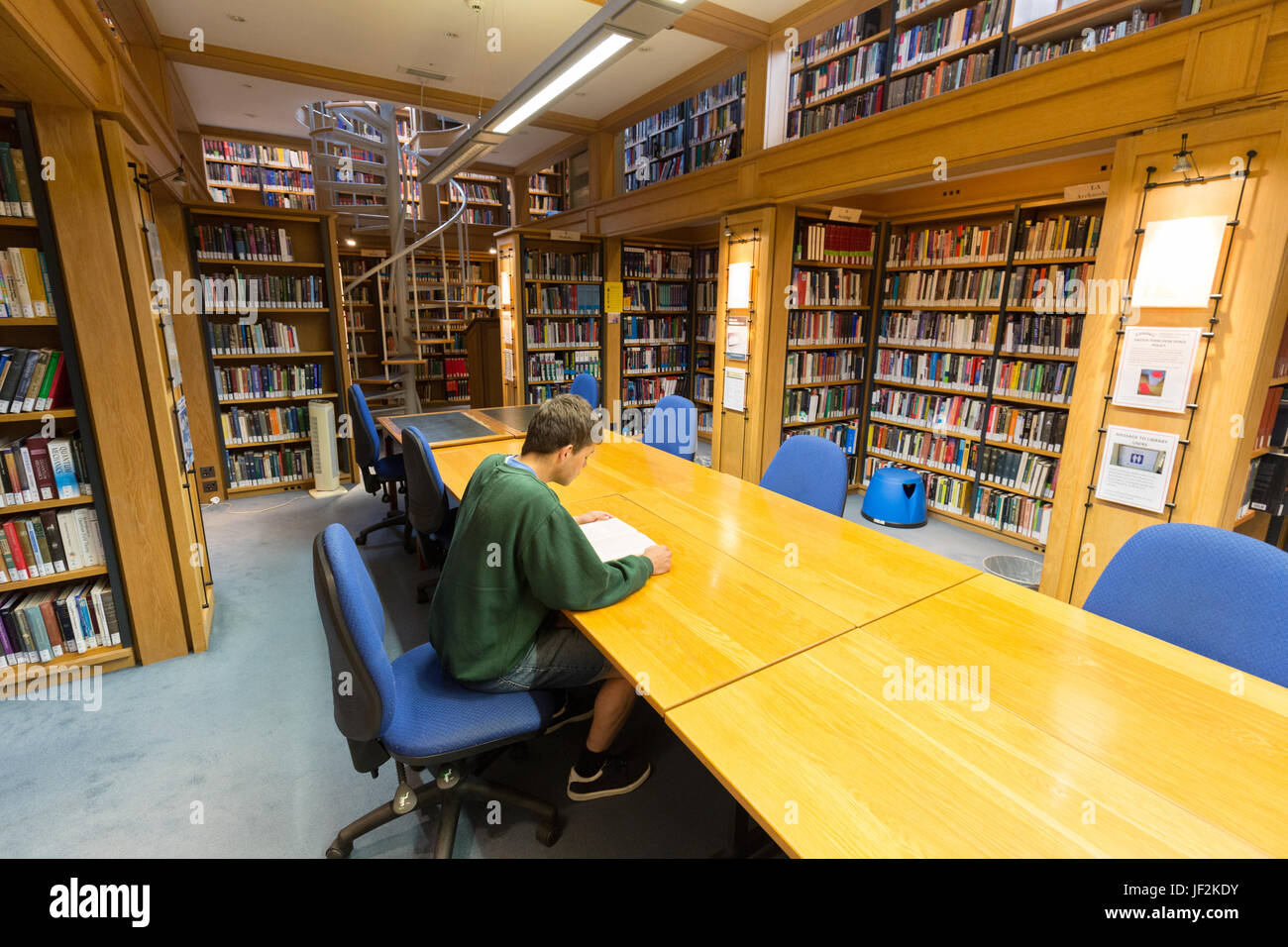 Cambridge University student studying in the library, Queens College, Cambridge University, Cambridge England UK Stock Photo