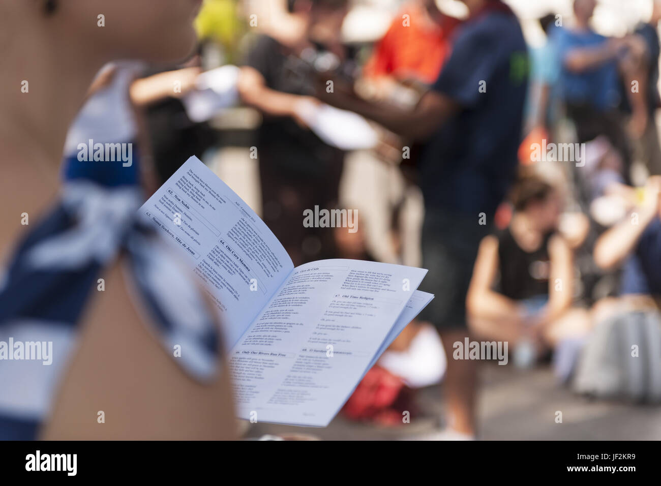 Song book in front of blurred street scene Stock Photo