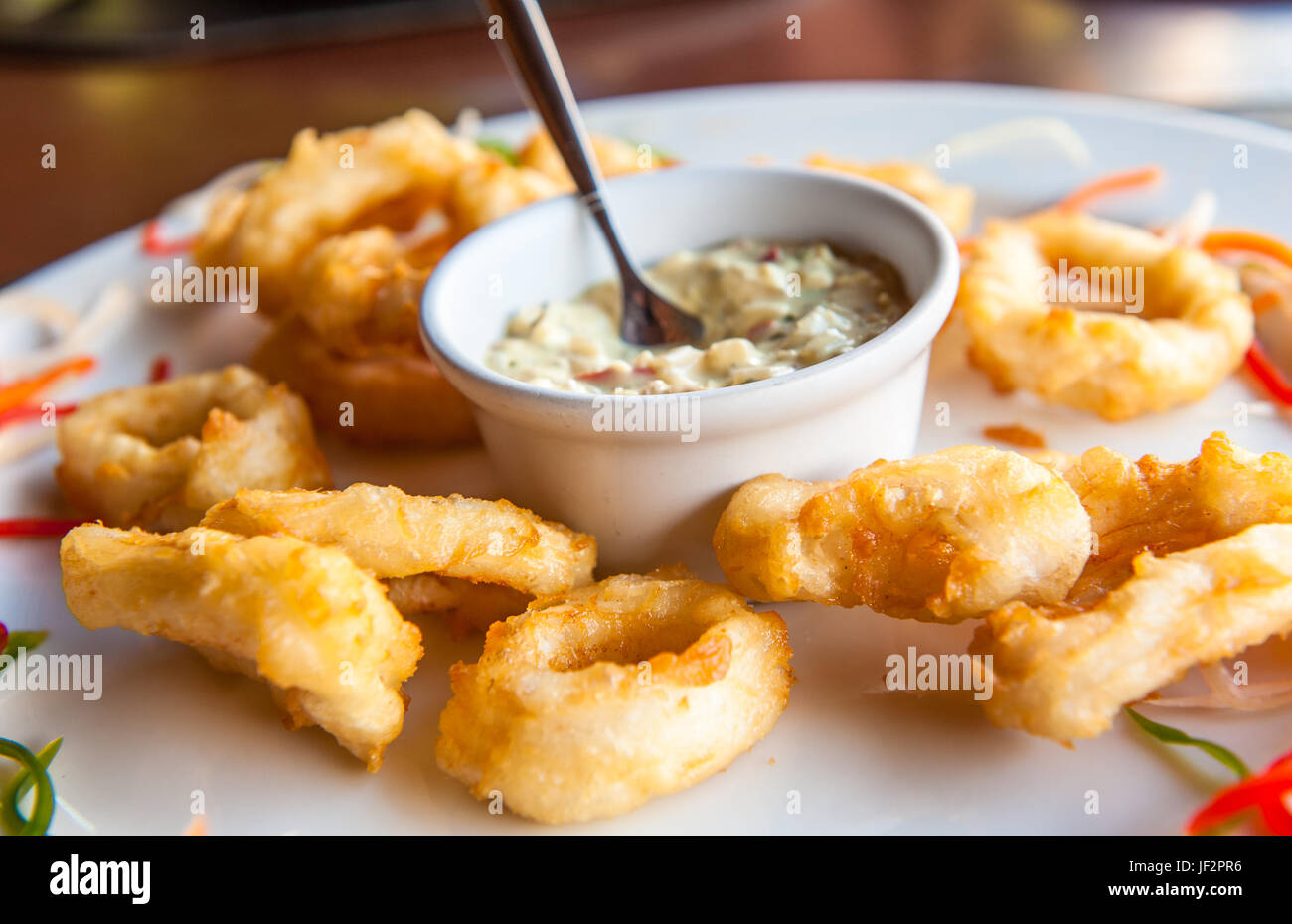 Deep fried calamari rings with sauce bowl Stock Photo Alamy