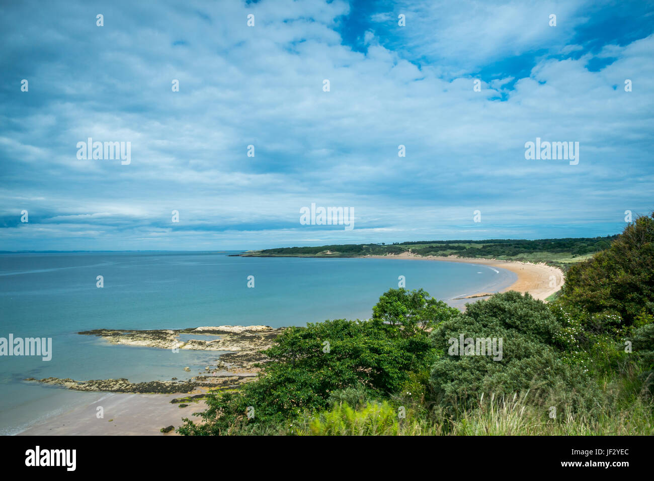 Broad view of wide sandy beach, Gullane, East Lothian, Scotland, UK,  on Summer day with blue sky and wispy clouds Stock Photo