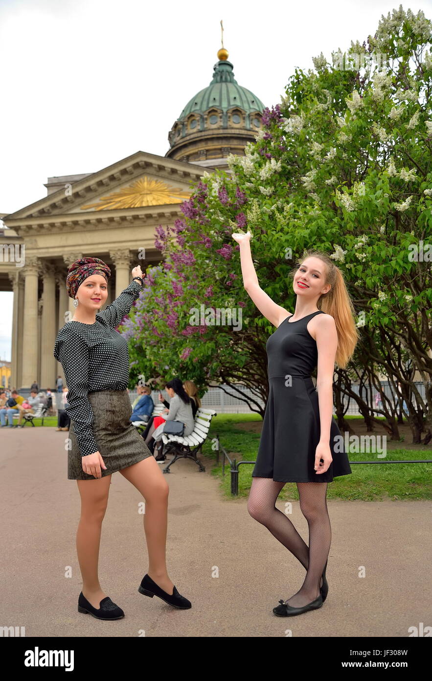 Beautiful girls show up on the Kazan Cathedral and the blossoming lilac in  Saint-Petersburg Stock Photo - Alamy