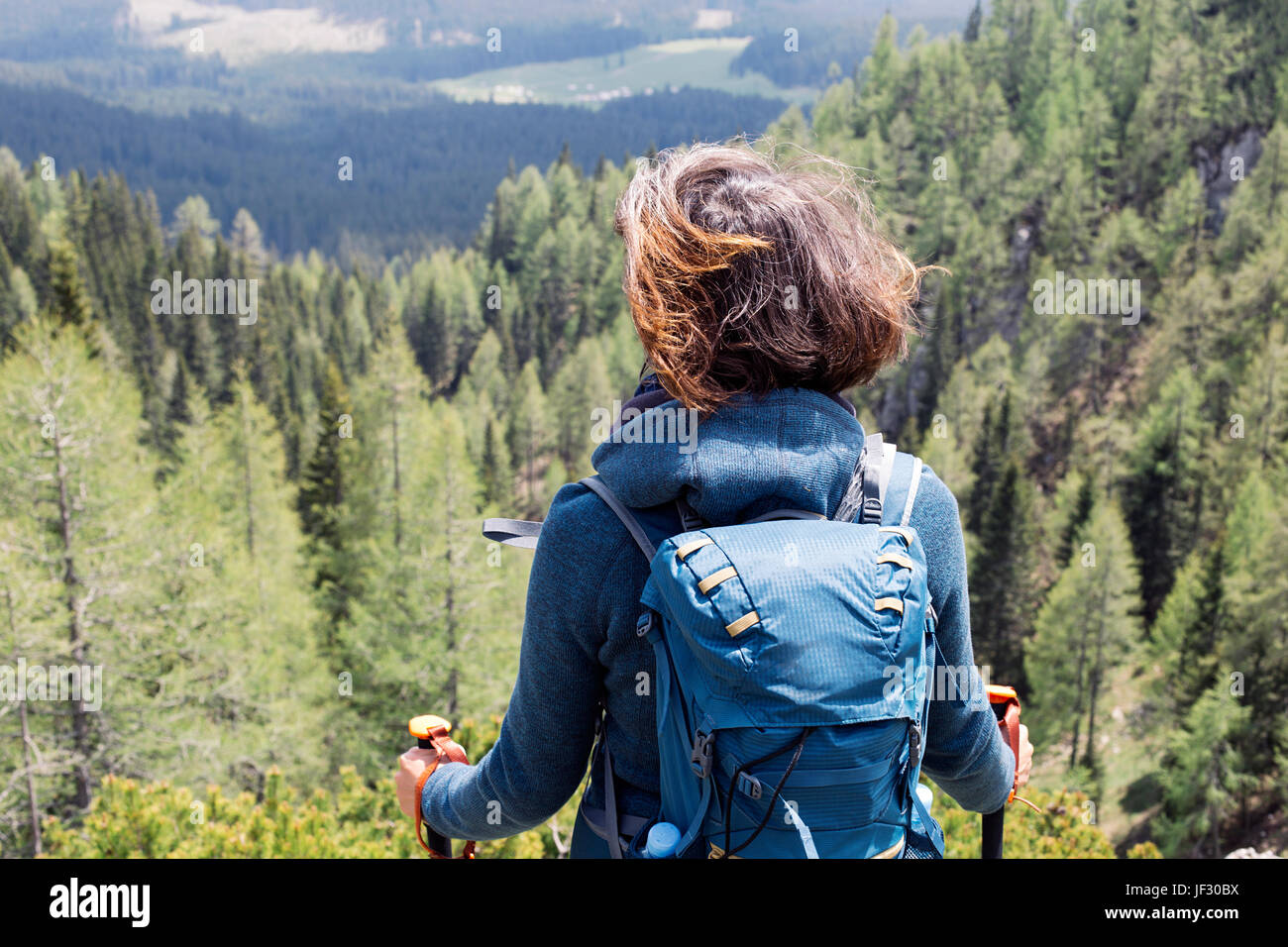 View at young woman hiking in mountain Stock Photo - Alamy