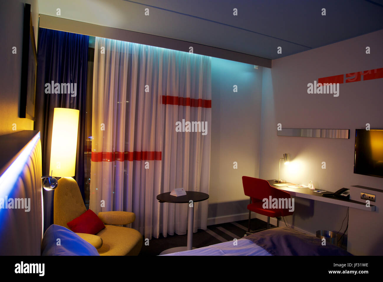 OSLO, NORWAY- JAN 20th, 2017: Interior of a double bed luxury hotel room with LED lightning, desk and chair, airport hotel, Park Inn Stock Photo