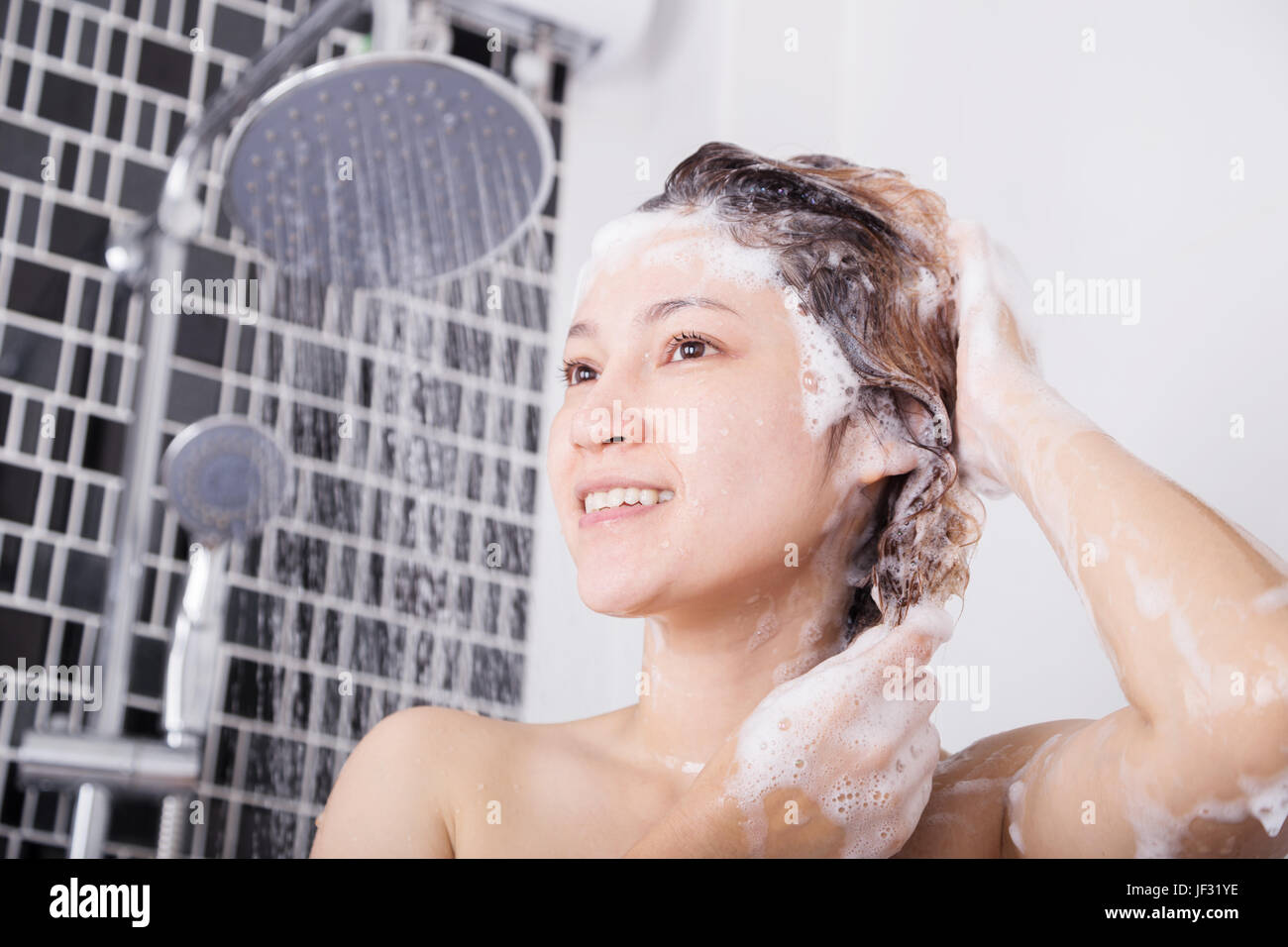 Woman bath shower head hires stock photography and images Alamy