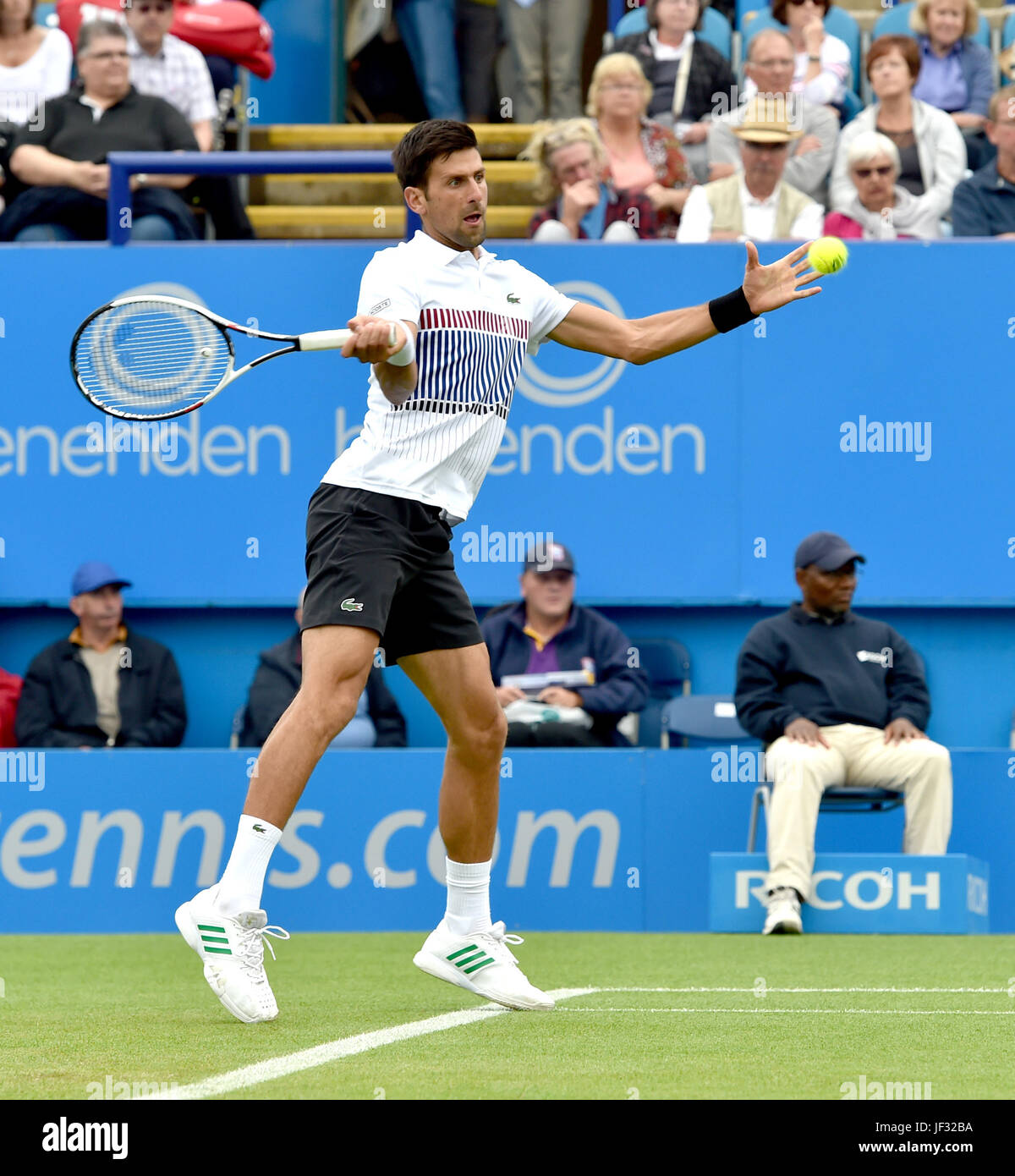 Novak Djokovic of Serbia in action at the Aegon International Eastbourne tennis tournament at Devonshire Park , Eastbourne Sussex UK . 28 Jun 2017 Photograph taken by Simon Dack Stock Photo