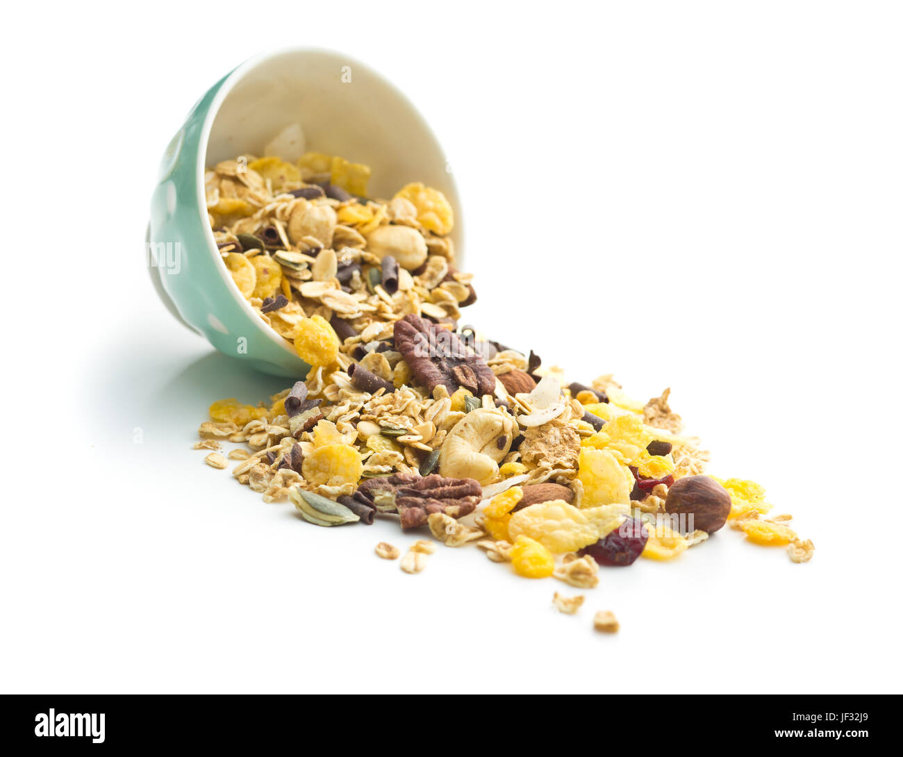 Tasty homemade muesli with nuts in bowl isolated on white background. Stock Photo