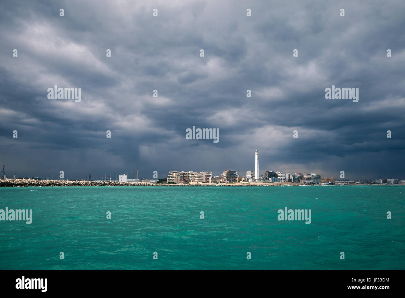 Lighthouse in a cloudy day with a storm approaching Stock Photo