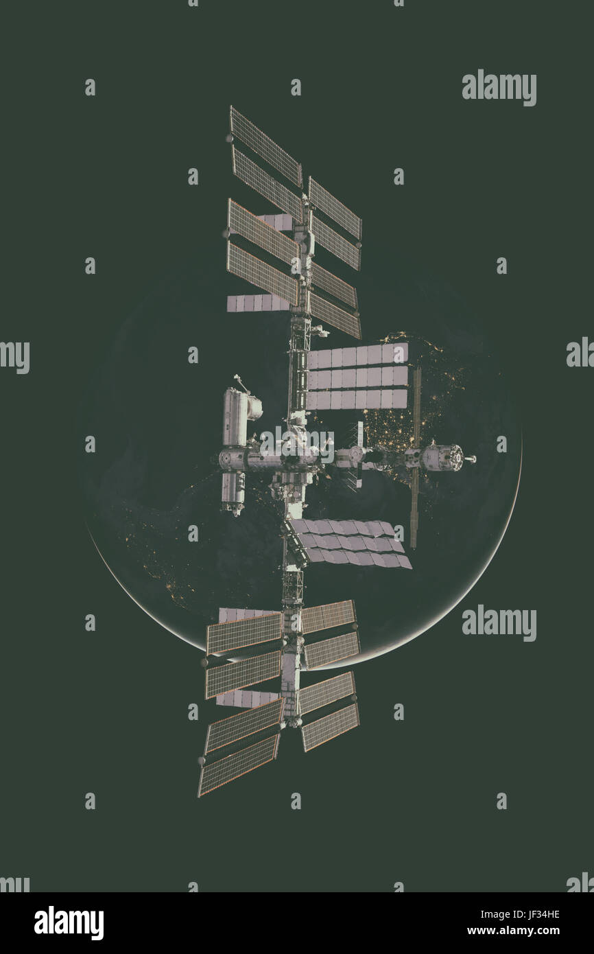 International Space Station over the planet Earth. Elements of this image furnished by NASA. Stock Photo