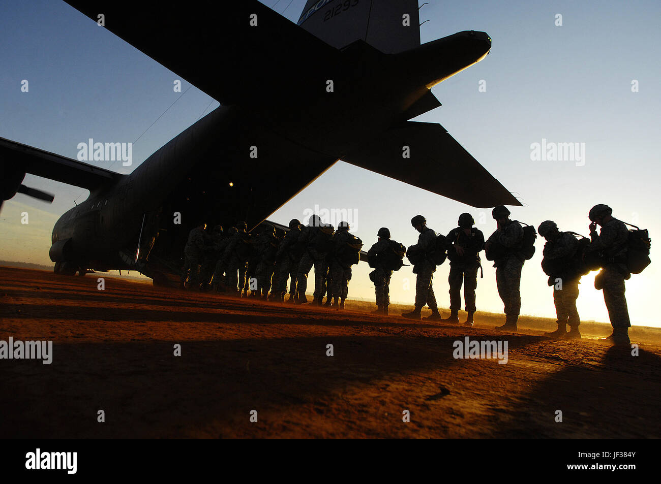 061216-F-5964B-475  U.S. Army paratroopers board a C-130 Hercules aircraft during the 9th Annual Randy Oler Memorial Operation Toy Drop at Fort Bragg, N.C., on Dec. 16, 2006. Soldiers donated a toy in exchange for a chance to make a non-tactical, training parachute jump with German or Australian jumpmasters.  Since its inception, Operation Toy Drop has collected and distributed more than 20,000 toys for families of soldiers and for local orphanages.  DoD photo by Staff Sgt. Jacob N. Bailey, U.S. Air Force.  (Released) Stock Photo