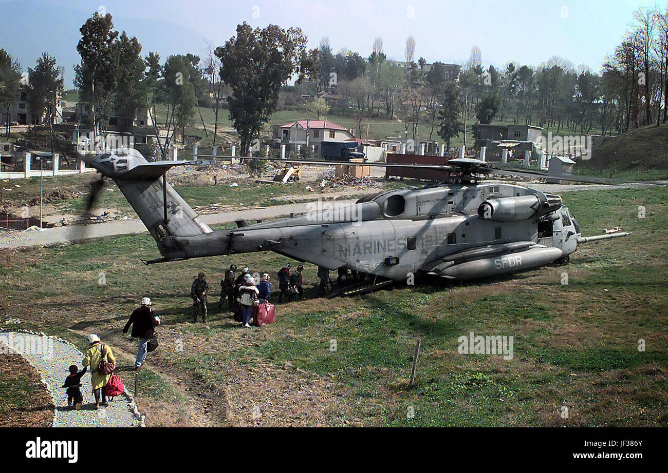 970315-N-0000S-001 American citizens board a U.S. Marine Corps CH-53 Super Stallion combat assault helicopter in a field inside the U.S. Embassy housing compound in Tirana, Albania, on March 15, 1997.  Operation Silver Wake is the evacuation of noncombatants from Albania to ensure the safety of American citizens and designated third country nationals.  U.S. Naval forces from the USS Nassau (LHA 4) Amphibious Readiness Group continue to evacuate citizens from the U.S. Embassy in Tirana.  DoD photo by Petty Officer 2nd Class Brett Siegel, U.S. Navy. Stock Photo