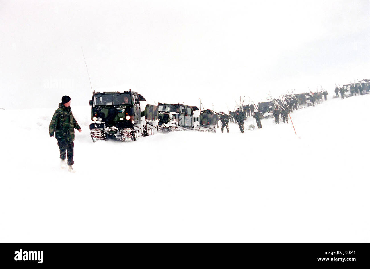 970126-M-8708Y-003 Marines from 2nd Marine Regiment head back down to base camp at the Mountain Warfare Training Center, Bridgeport, Calif., as near white-out conditions set in on Jan. 26, 1997.   Training is suspended in the poor weather conditions for safety reasons.   Marines from the 2nd Marine Regiment and 3rd Battalion, 8th Marines of Camp Lejeune, N. C. are at the Mountain Warfare Training Center, Bridgeport, Calif., to train in cold weather survival and arctic warfare.  DoD photo by Lance Cpl. E.J. Young, U.S. Marine Corps. Stock Photo