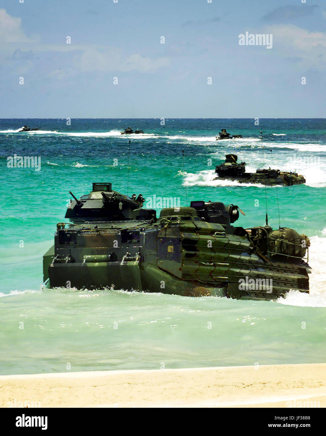 010806-N-6141B-502 U.S. Marine Corps Armored Amphibious Vehicles emerge from the surf to land at Blue Beach on the island of Vieques, Puerto Rico, on Aug. 6, 2001.  The Marines, deployed from Camp Lejeune, N.C. , are participating in a Supporting Arms Coordination exercise designed to provide advanced-level training for Marine forces.  DoD photo by Chief Petty Officer Alan Baribeau, U.S. Navy.  (Released) Stock Photo