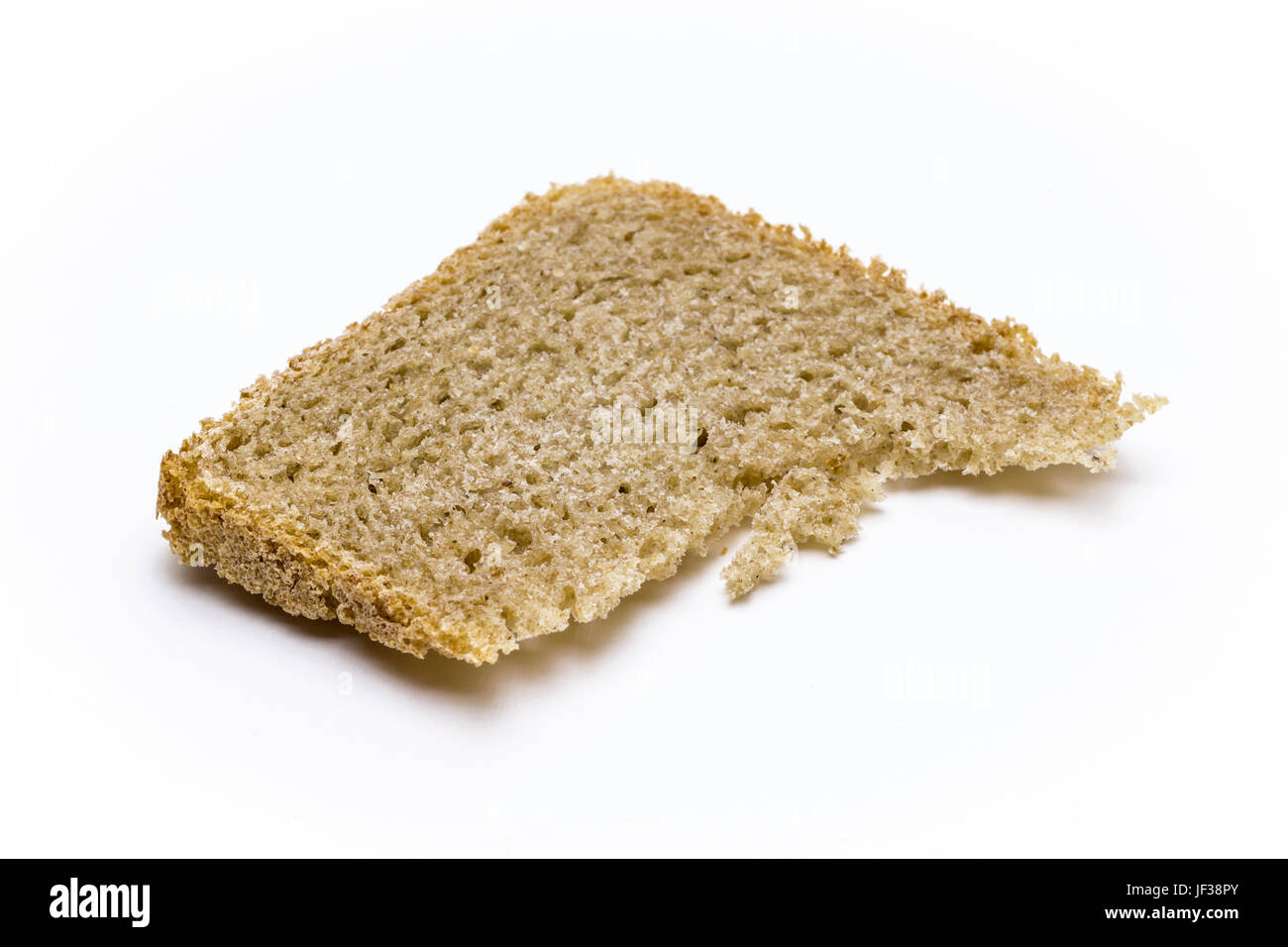 Single slice of brown bread close-up on a white background Stock Photo ...