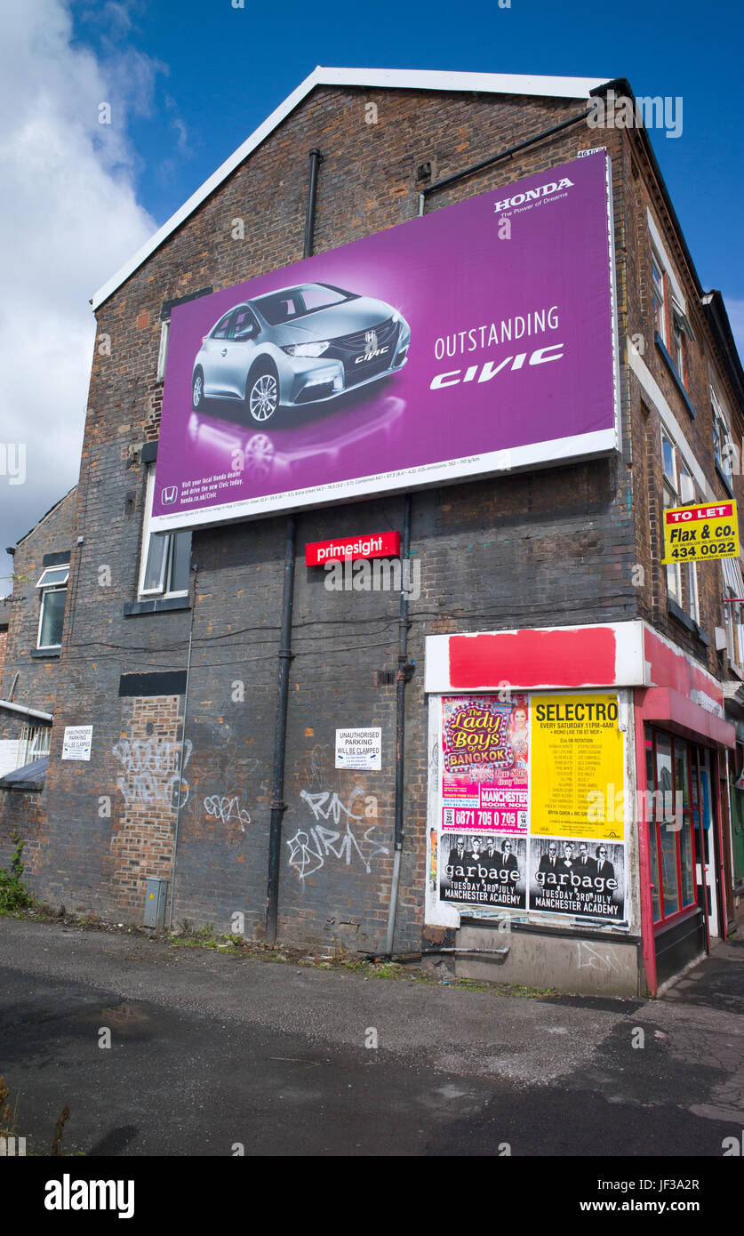 Billboard advertising Honda Civic and posters advertising music on end