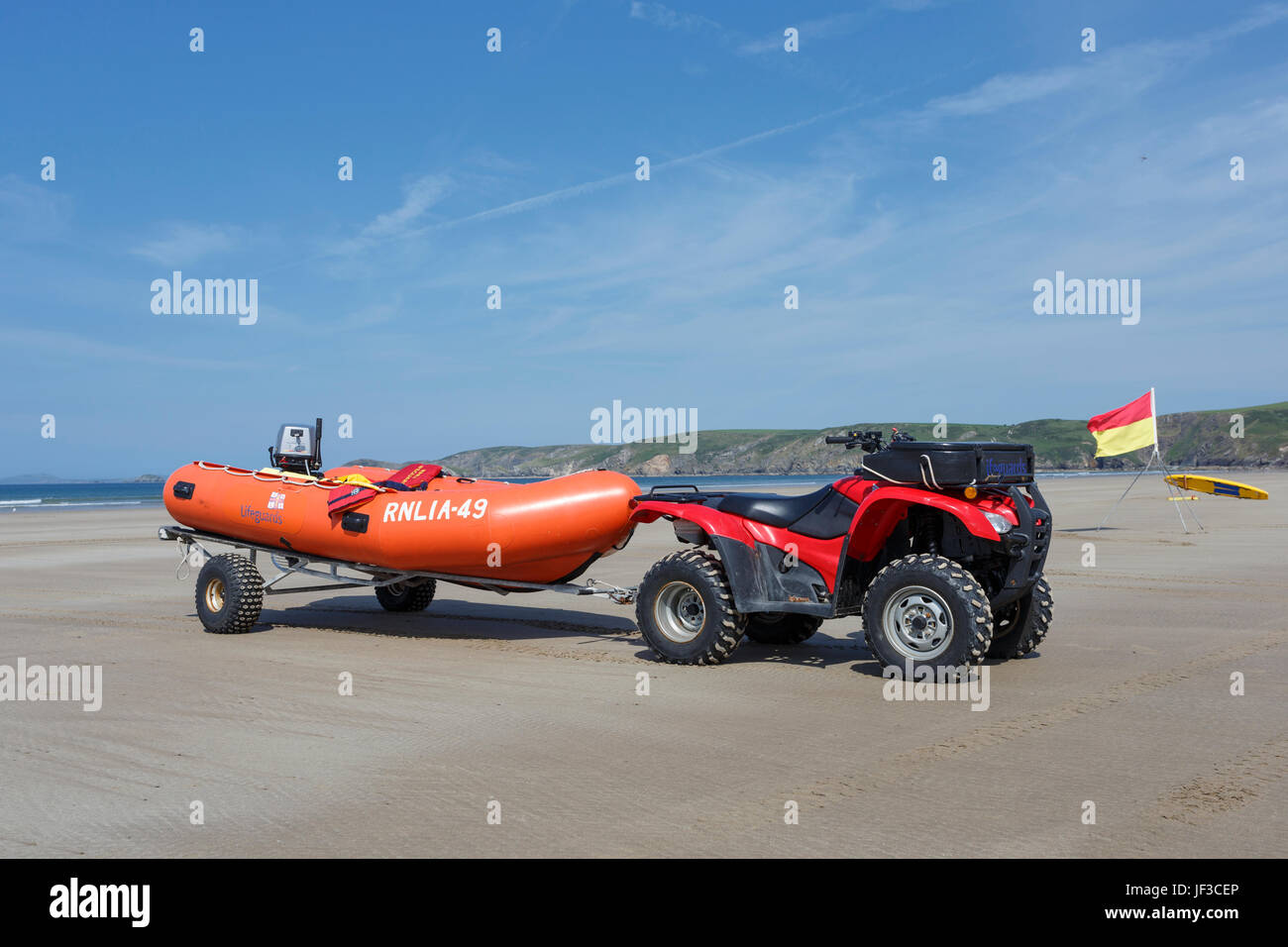 Lifeguard's inflatable dingy and tractor on Newgale Beach, Pembrokeshire, Wales Stock Photo