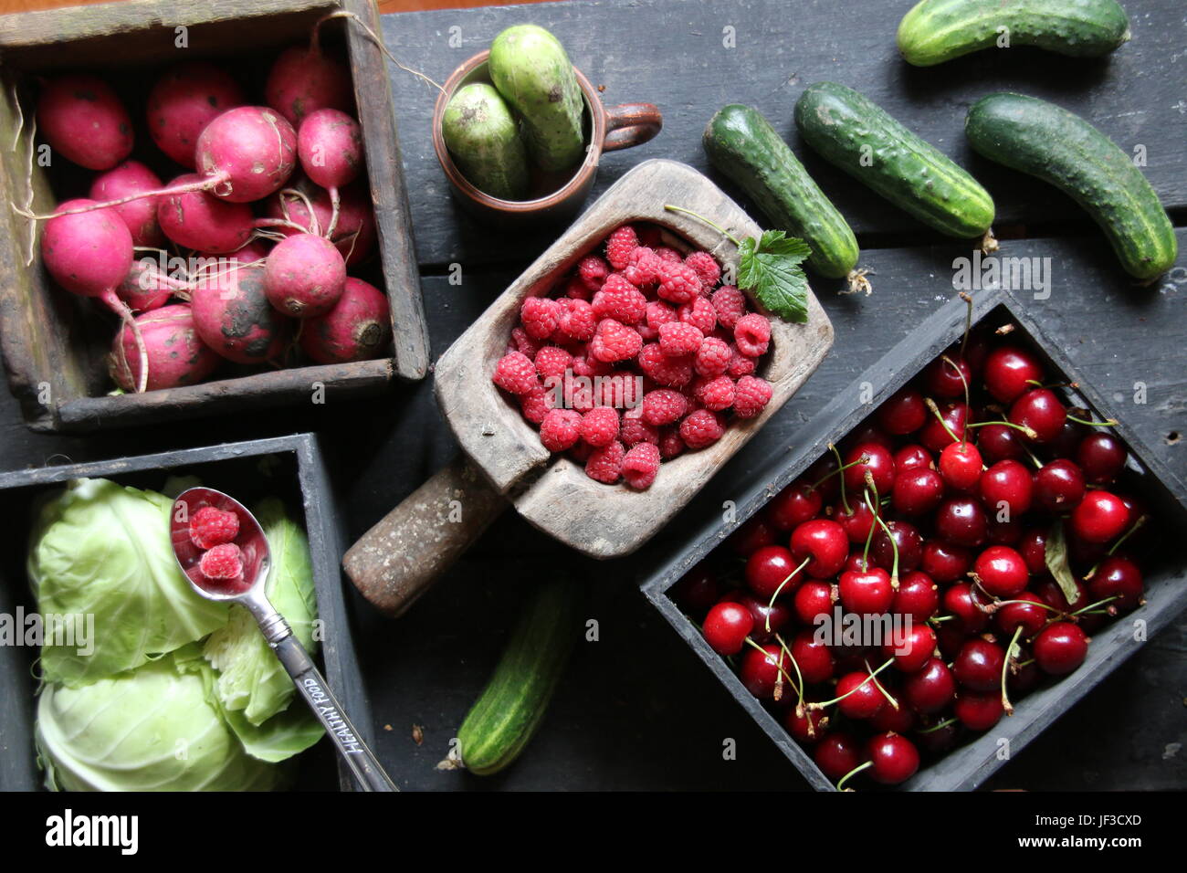 Healthy eating, food, dieting and vegetarian concept. Berries and vegetables on the table. Stock Photo