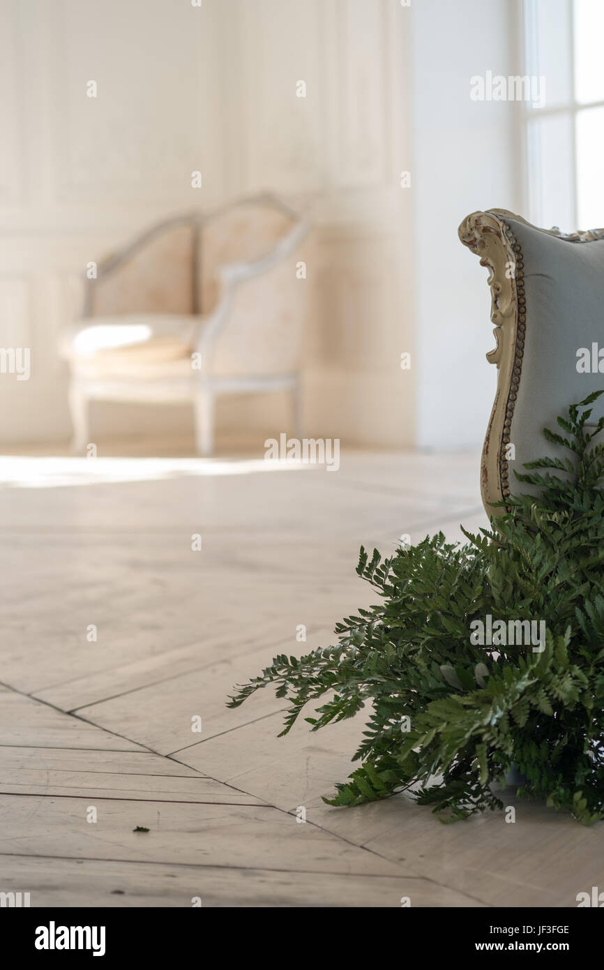 Vintage armchair in luxury bright white interior Stock Photo - Alamy