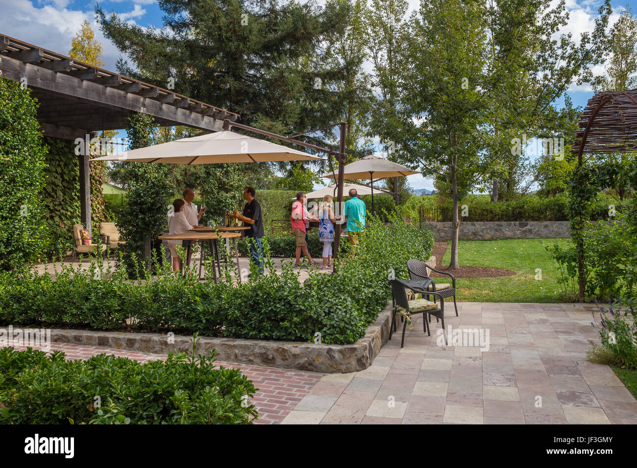 people, tourists, adults, couple, outdoor wine tasting, wine tasting, Caymus Vineyards, Rutherford, Napa Valley, Napa County, California Stock Photo