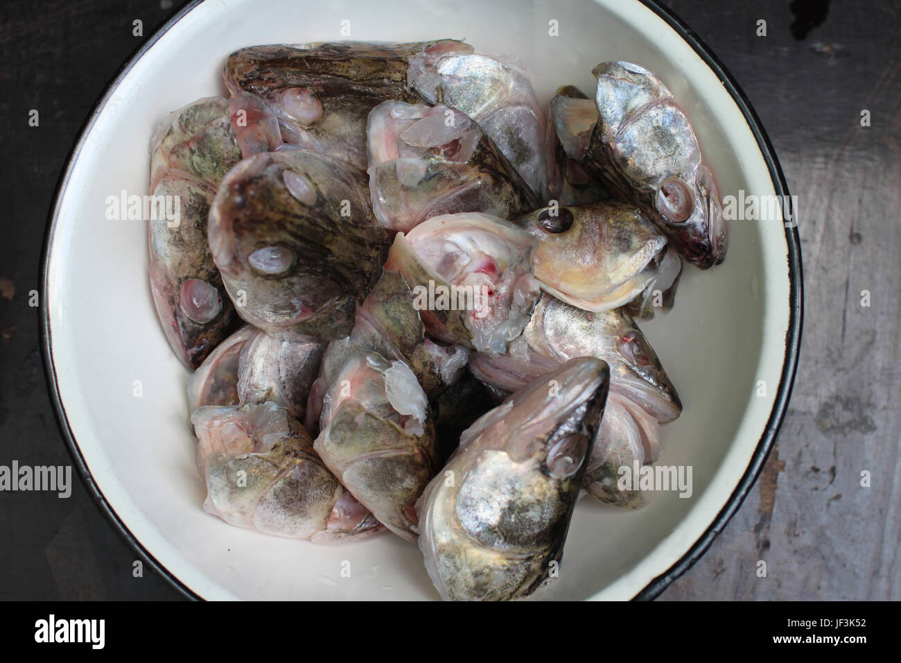 bowl with fish head Stock Photo Alamy