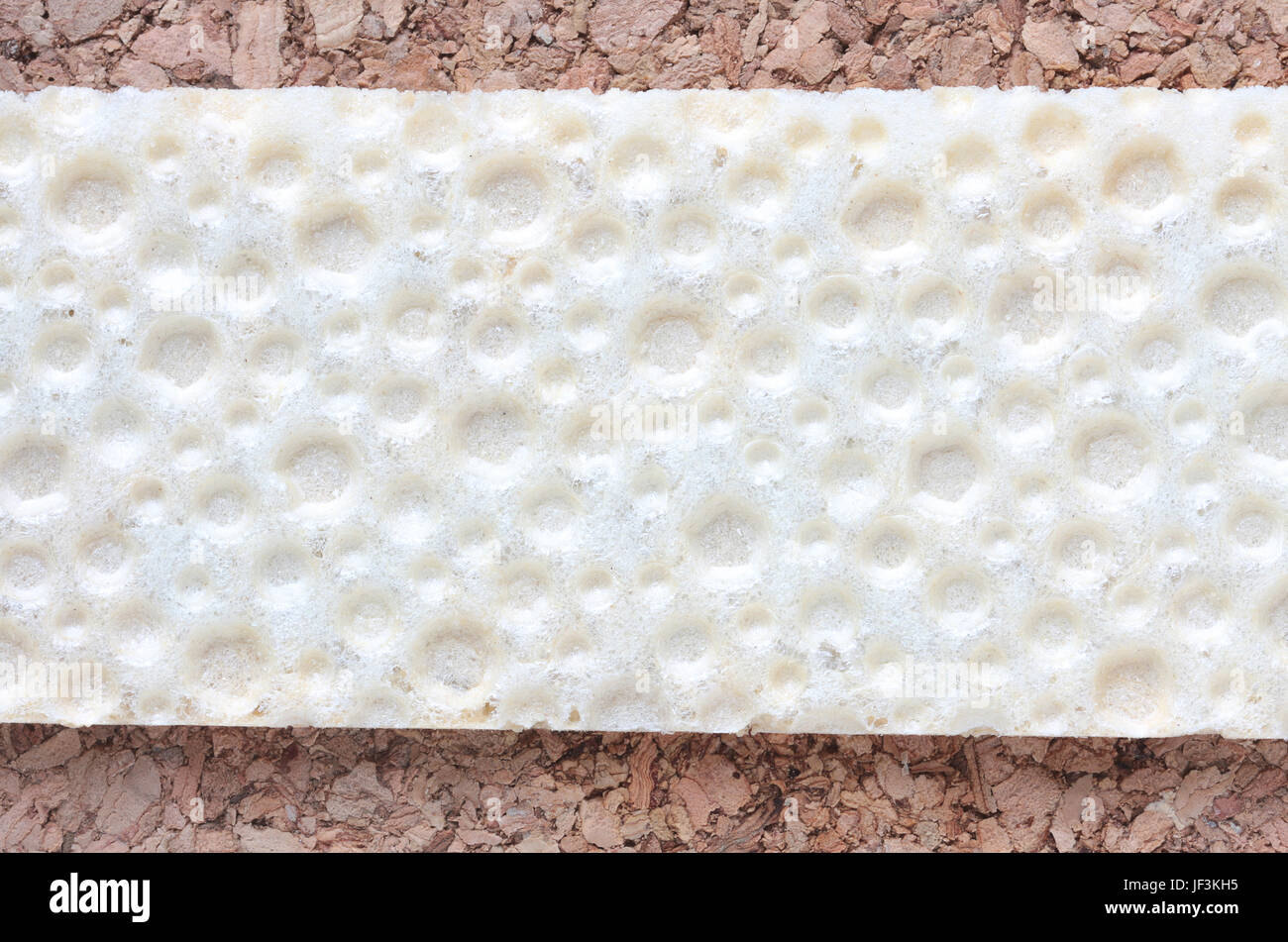 Cork tile texture sample, with copyspace on yellowish color decorative pattern Stock Photo