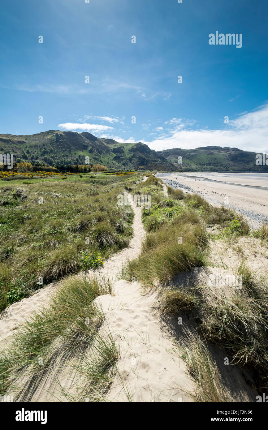 Conwy Morfa beach with Penmaen bach point in the distance Stock Photo