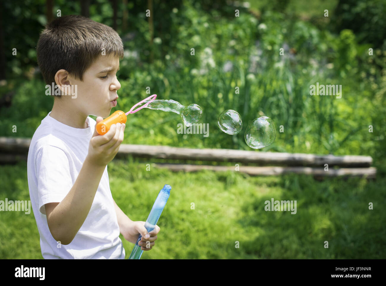 Child makes bubbles Stock Photo Alamy
