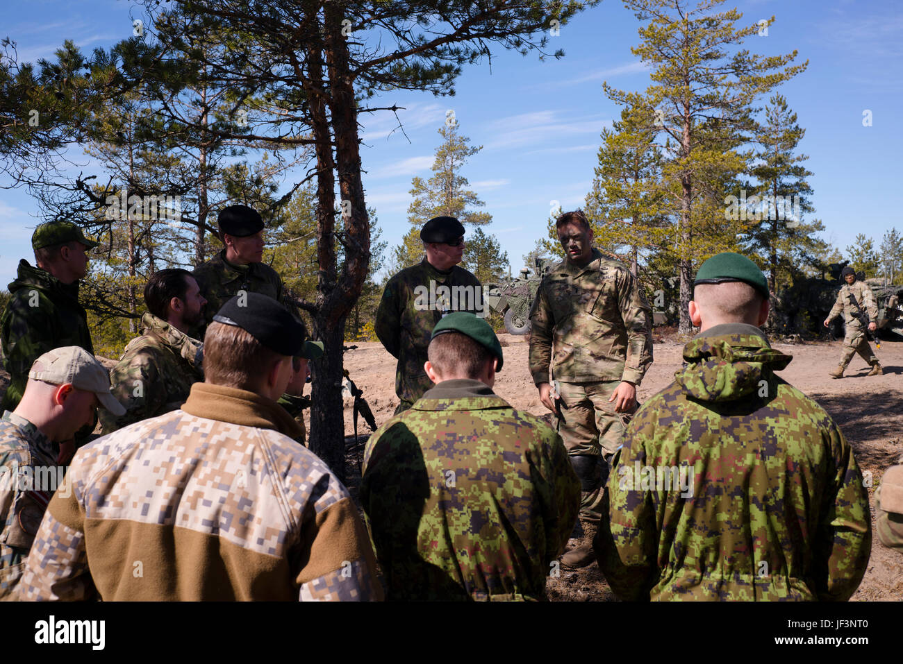 U.S. Army 1st Lt. Blake Hunnewell of Apache Troop, 1st Squadron, 2nd Cavalry Regiment, talks about the training that is taking place in Pohjankangas, Niinisalo, Finland, May 5, 2017. The Troop, alongside Finnish and Norwegian Soldiers, participated in Arrow 17, an annual Finnish training exercise that enhances interoperability and the capability of mechanized, motorized and armoured units to perform tactical manoeuvres together. (U.S. Army photo by Spc. Elliott Banks) Stock Photo