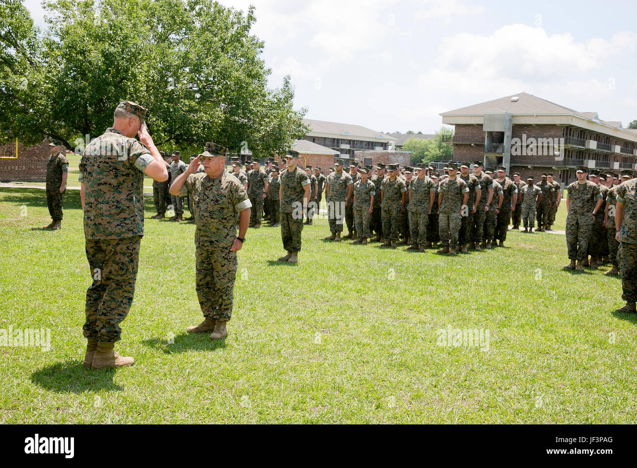 U.S. Marines and Sailors with 2nd Medical Battalion, II Marine Expeditionary Force (II MEF), stand in formation before receiving the “Lt. Gen. Chesty Puller” Outstanding Leadership Award on Camp Lejeune, N.C., May 10, 2017. The battalion earned this award for exceptional professional ability, superior performance and dedication to supporting the mission of the II MEF. (U.S. Marine Corps photo by Sgt. Kelly L. Street) Stock Photo