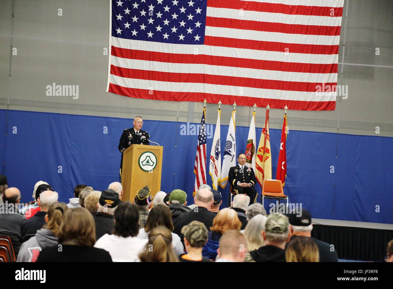 Fort McCoy Garrison Commander Col. David J. Pinter Sr. provides opening remarks during the Vietnam Veterans Welcome Home Ceremony on May 20, 2017, at Fort McCoy, Wis. Each veteran attending the ceremony received a Vietnam Veterans Lapel Pin during the event. The ceremony was one of many taking place around the United States that officially recognizes veterans who served between May 1, 1955, and Nov. 15, 1975. The ceremony also was held in conjunction with the 2017 Fort McCoy Armed Forces Day Open House. (U.S. Army Photo by Scott T. Sturkol, Public Affairs Office, Fort McCoy, Wis.) Stock Photo