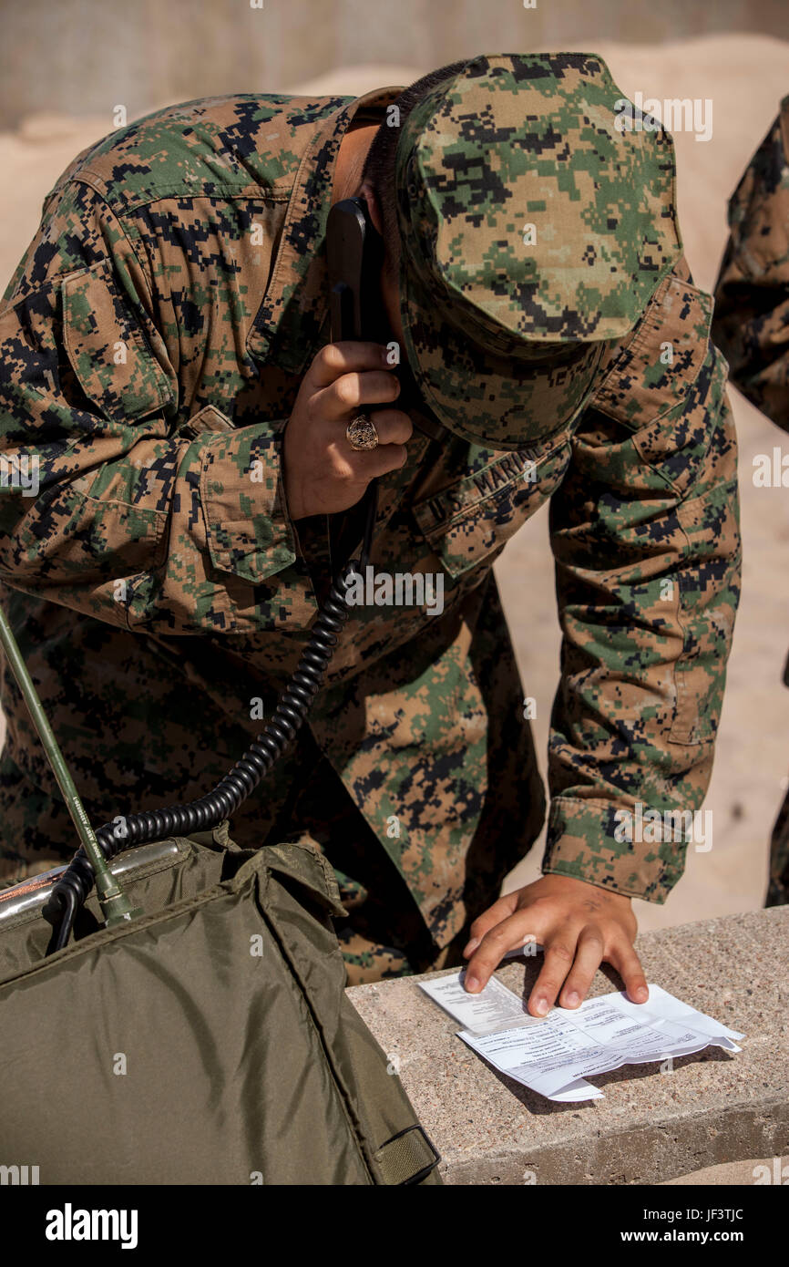 VENTSPILS, Latvia— Lance Cpl. Jong Yi with Combat Logistics Regiment 45, 4th    Marine Logistics Group, Marine Forces Reserve, communicates with the Combat    Operation Center in preparation for exercise Saber Strike 17 in Ventspils,    Latvia, May 22, 2017. Exercise Saber Strike 17 is an annual combined-joint    exercise conducted at various locations throughout the Baltic region and Poland.    The combined training prepares allies and partners to respond more to regional    crises and meet their own security needs by improving the security of borders and    countering threats. (U.S. Marine C Stock Photo