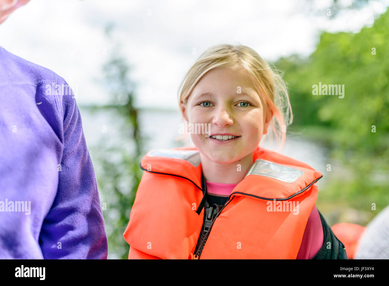 Portrait of girl wearing life jacket Stock Photo Alamy