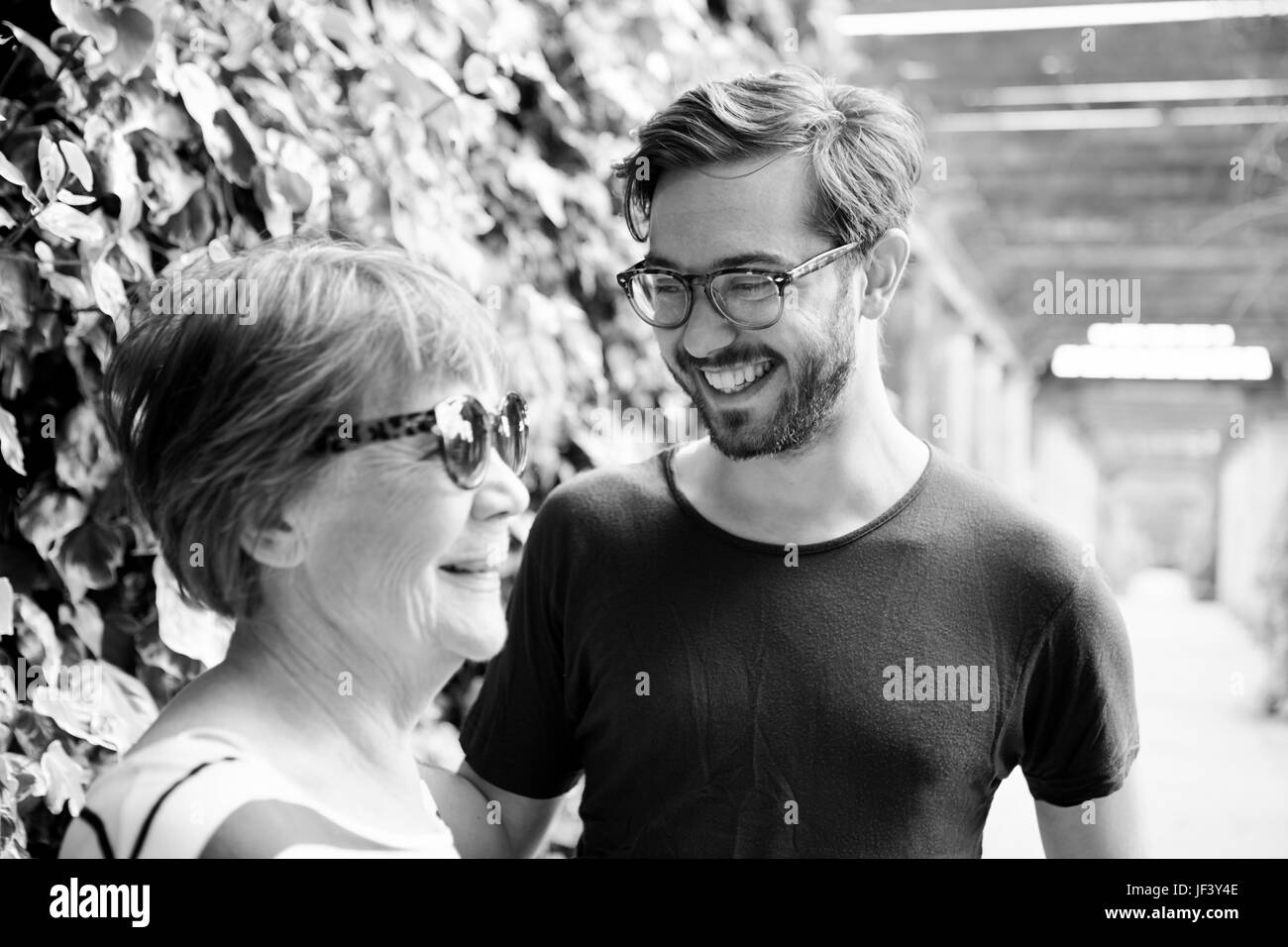 Smiling woman with adult son Stock Photo