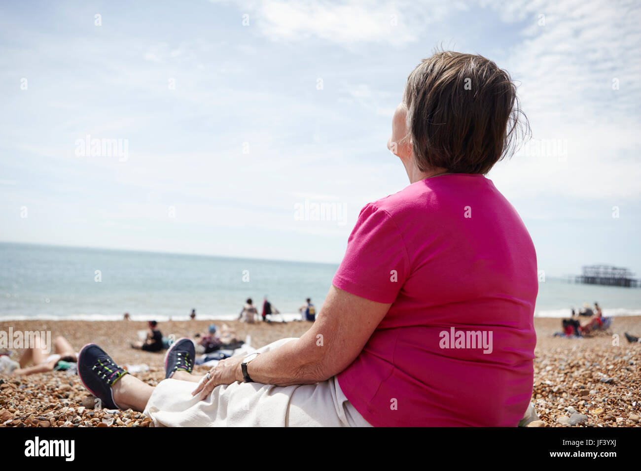 Senior woman relaxing on beach Stock Photo - Alamy