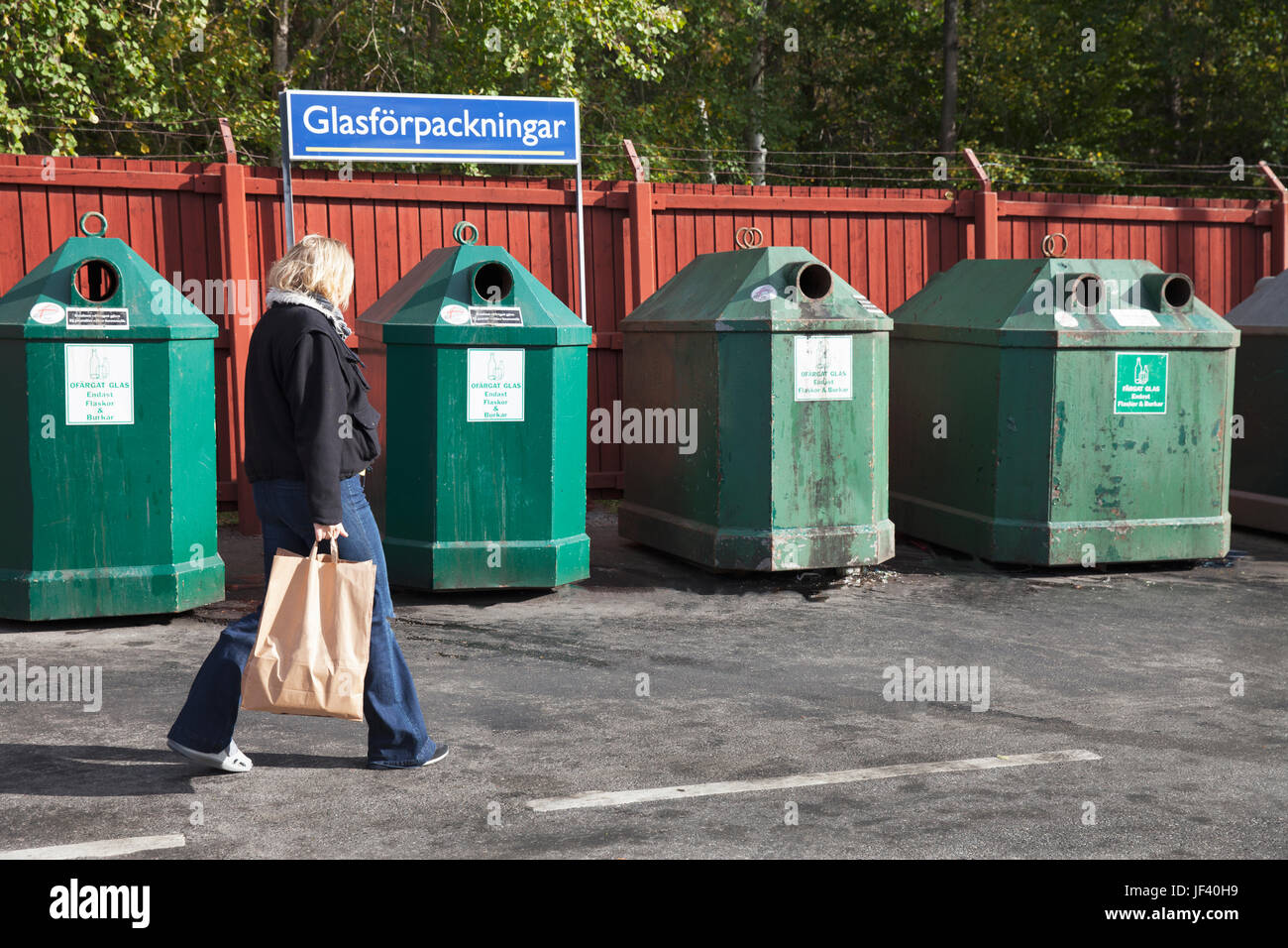 Woman near recycling bin Stock Photo Alamy