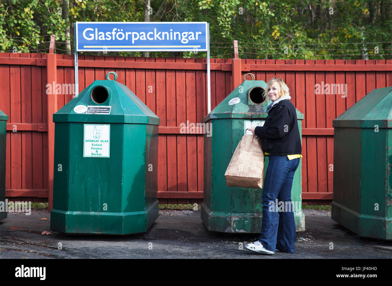 Woman near recycling bin Stock Photo Alamy