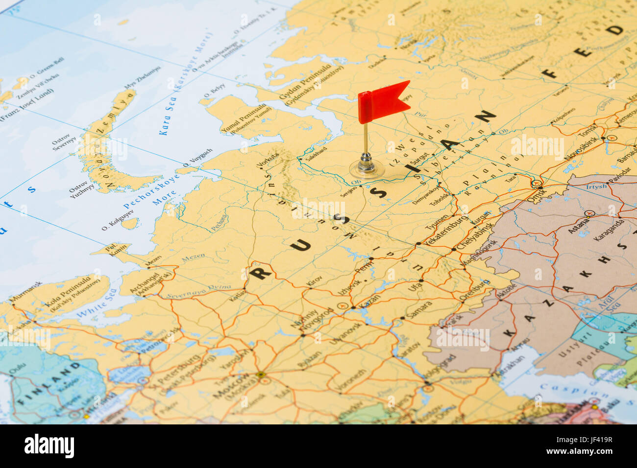 Photo of Russia marked by red flag in holder. Country on European continent. Stock Photo