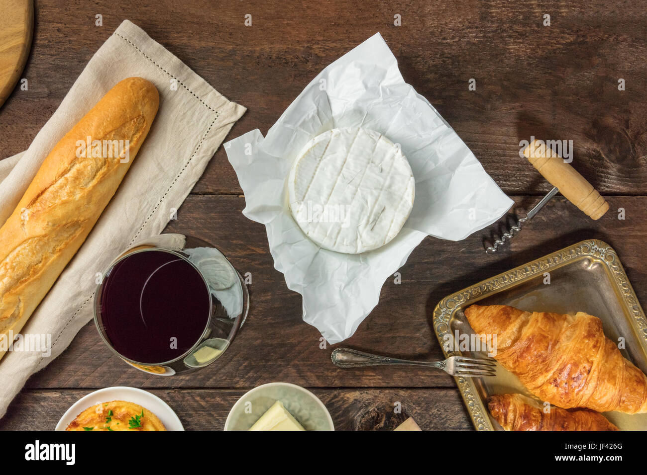 An overhead photo of an assortment of French food with copy space