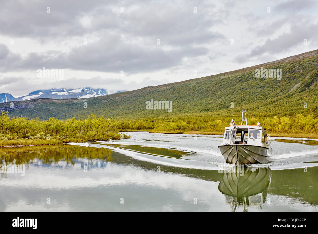 Boat on lake in mountains Stock Photo