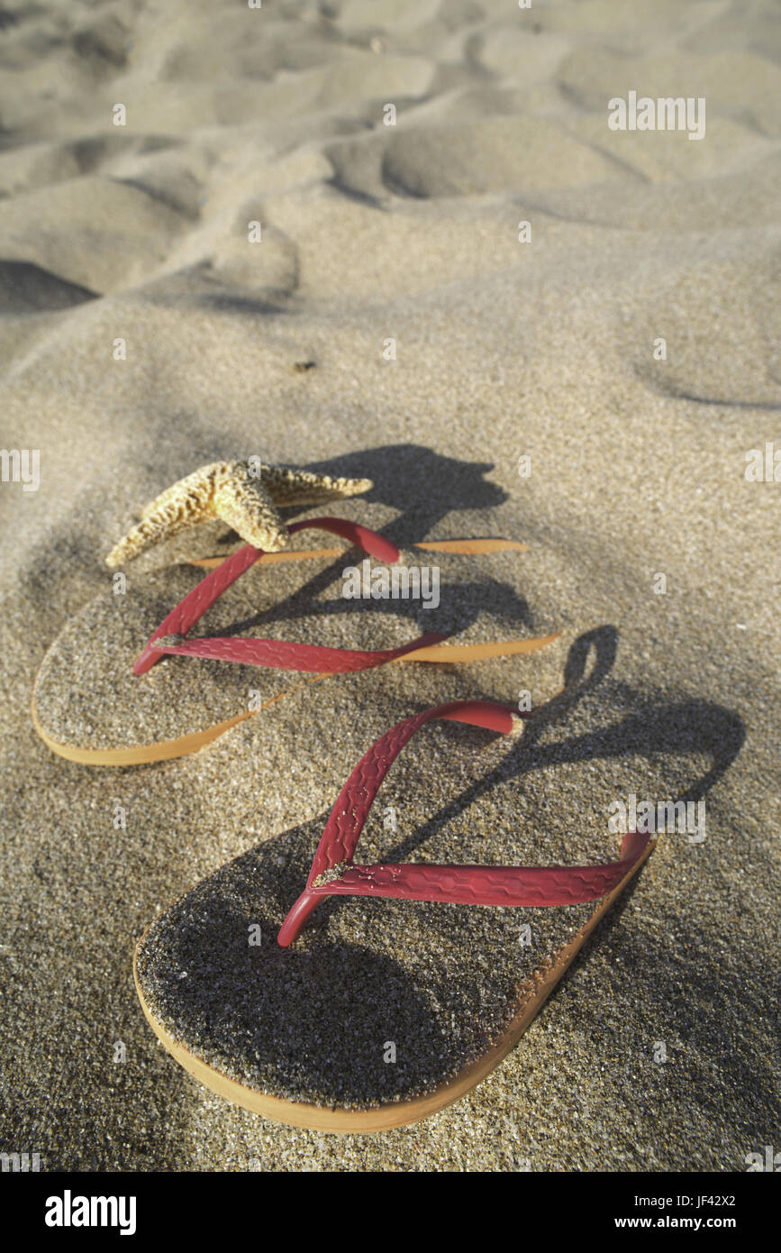 Sandals on the beach in the sand Stock Photo - Alamy