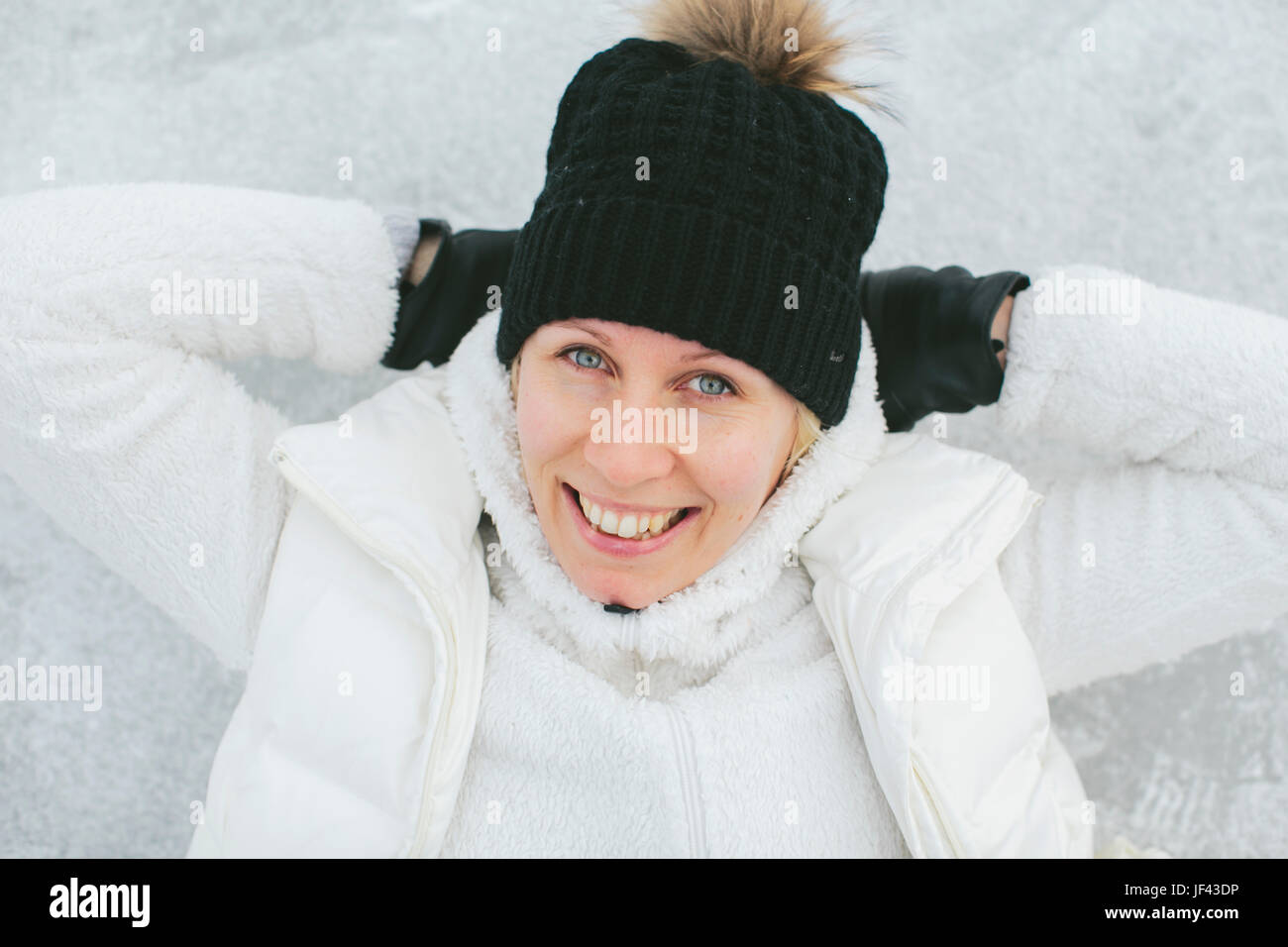 Young woman woolly hat smile hi-res stock photography and images - Alamy
