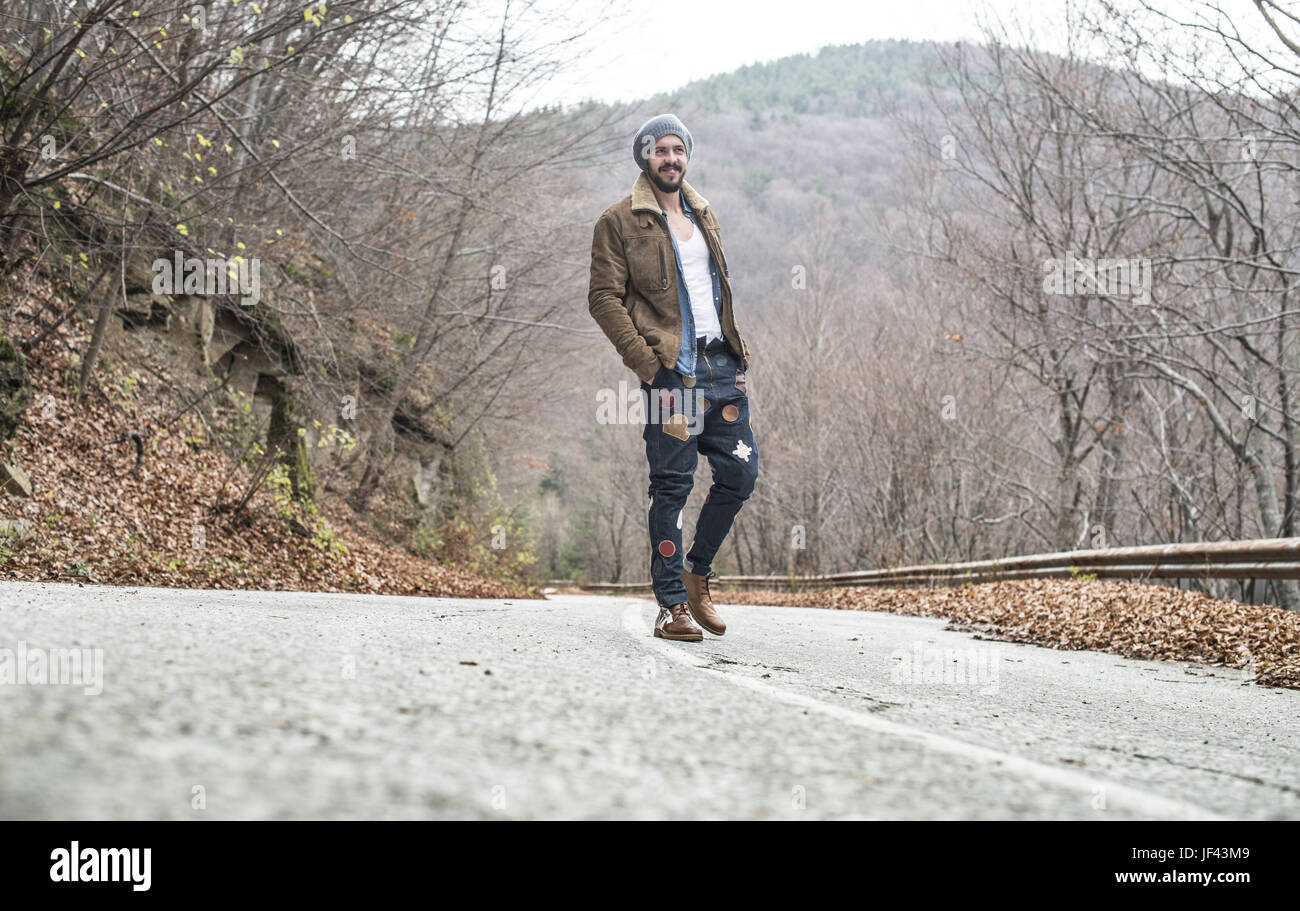 Men walking on the road Stock Photo