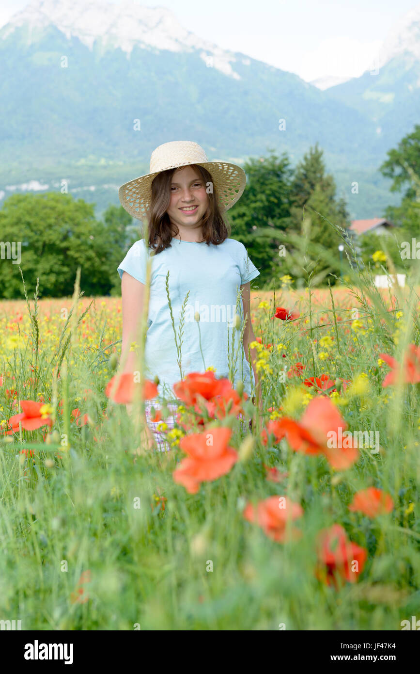 a young teenage girl in poppy field Stock Photo - Alamy